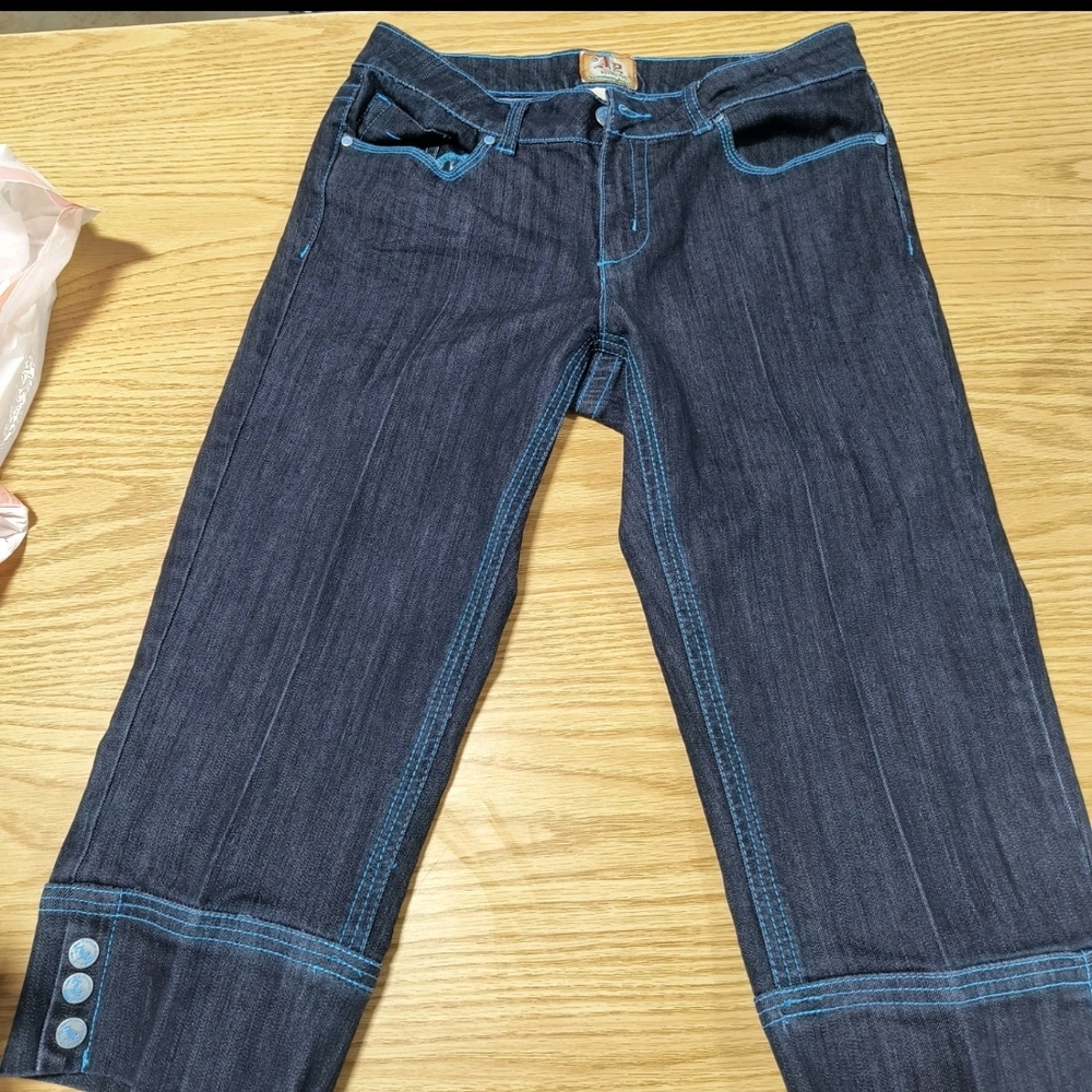 Gently Used J2 by Jou Jou Capris with Blue stitch and buttons at the bottom.
